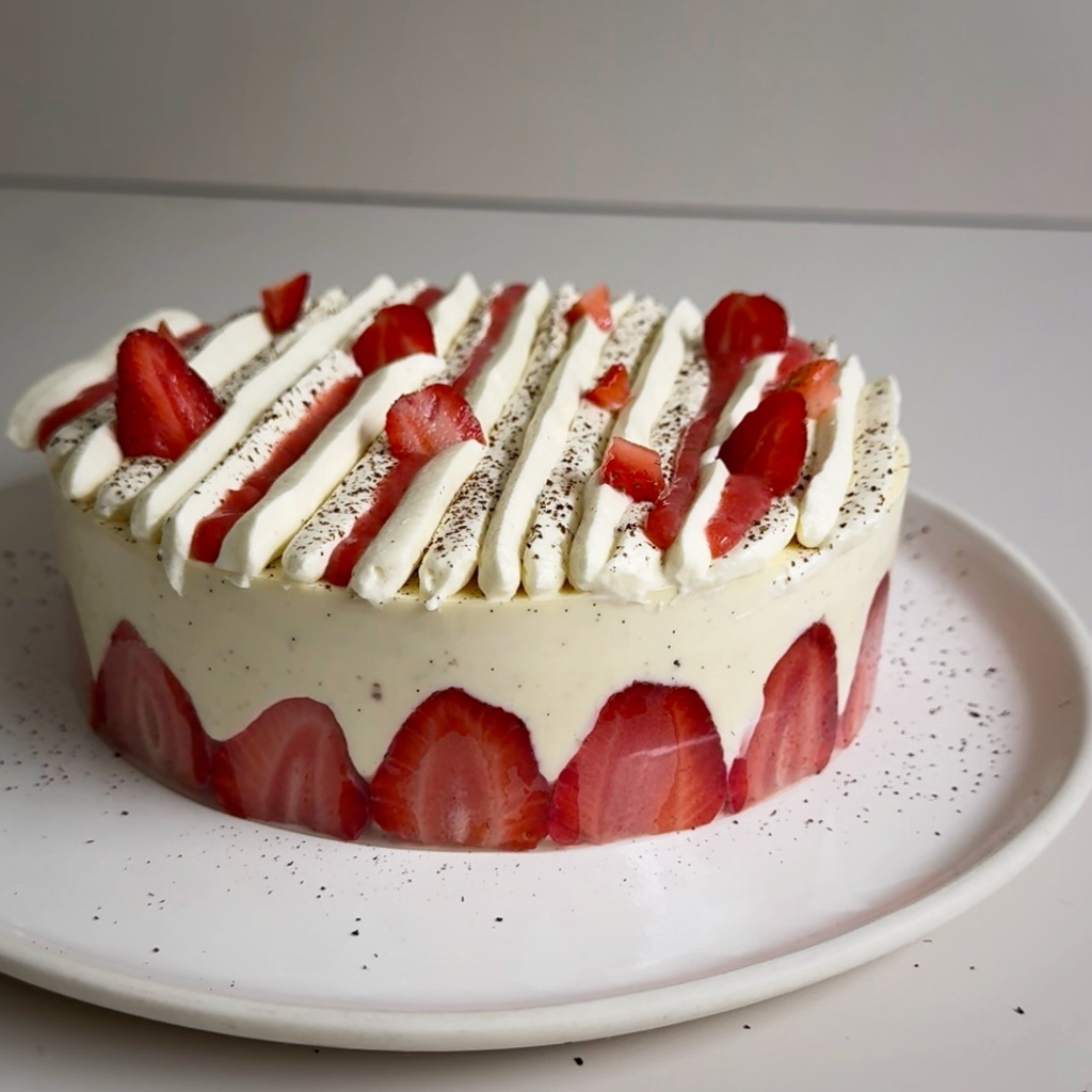 Strawberry Fraisier cake with fresh strawberries on top