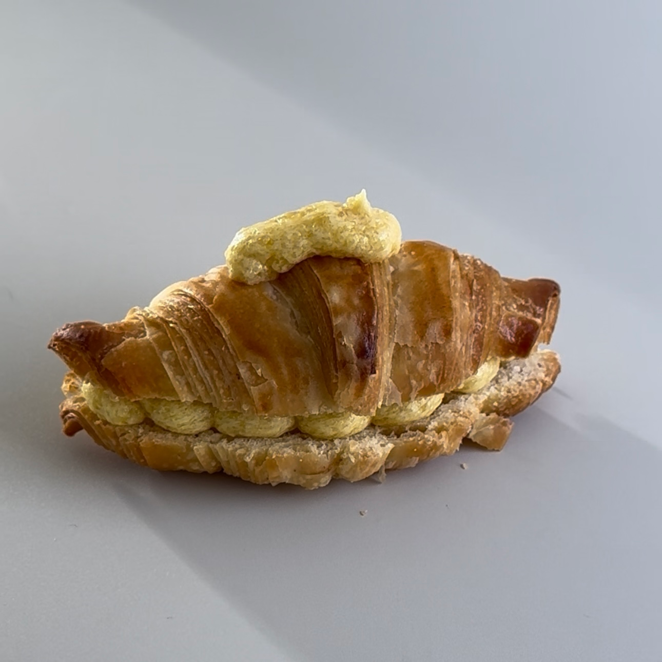 Step 3: Close Croissant, pipe Crem on Top
